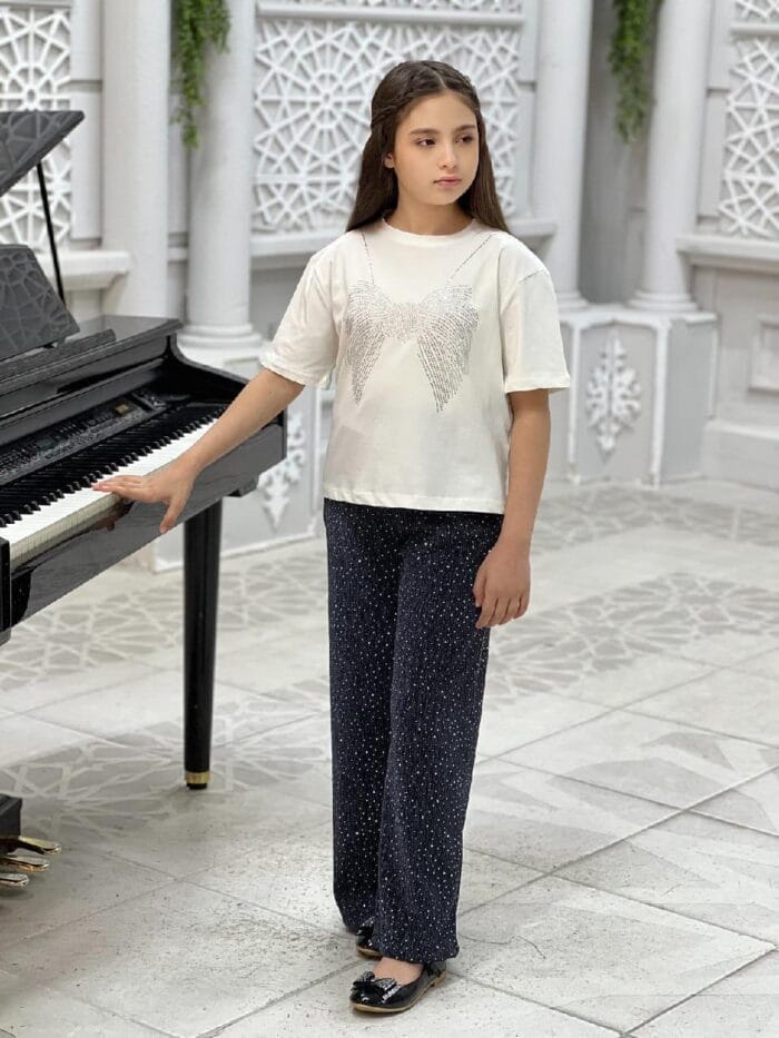 2-teiliges Set für Mädchen – Glitzer-Shirt in Beige & schwarze Palazzohose mit Punkten – Bild 2